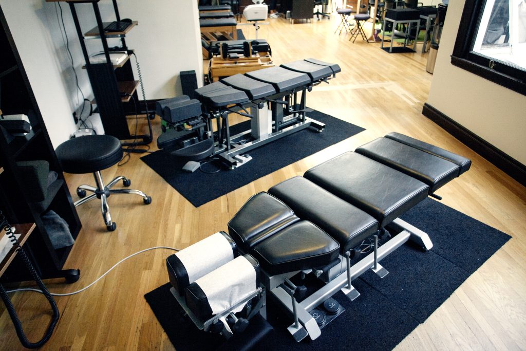 chiropractic office with adjustment tables and other chiropractic health care equipment